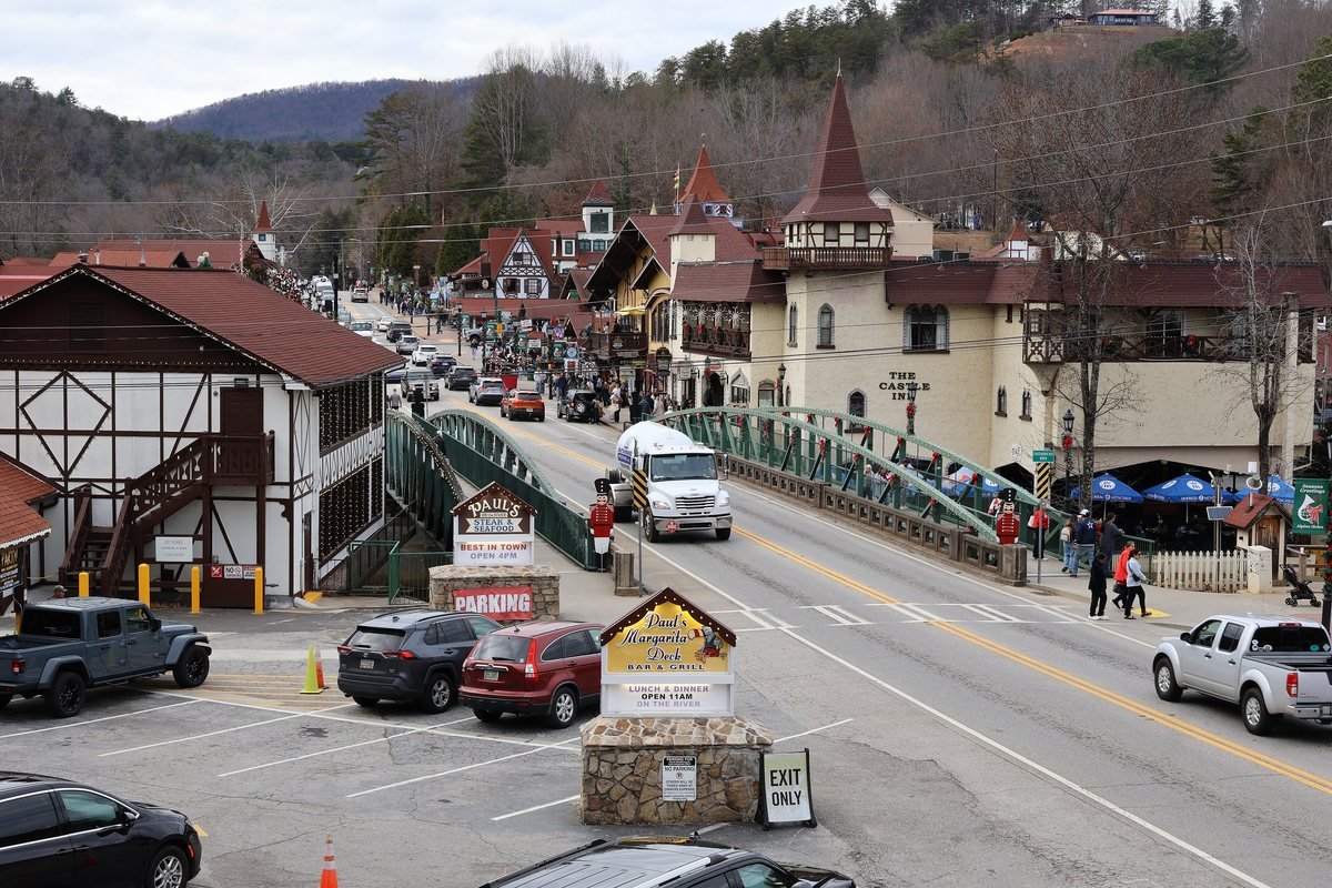 Downtown Helen, Georgia, with Bavarian-style buildings, a bridge over the Chattahoochee and mountains behind