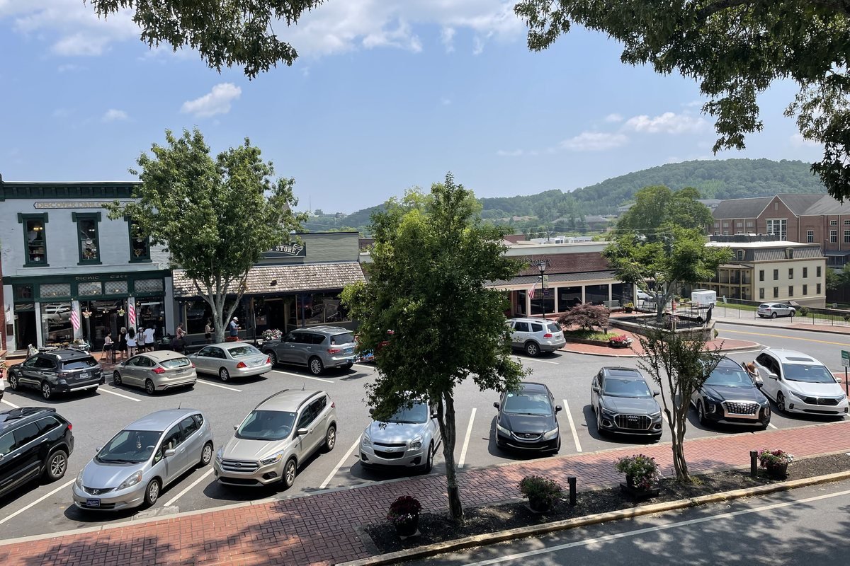 Shops around the public square in downtown Dahlonega, Georgia, with the mountains behind