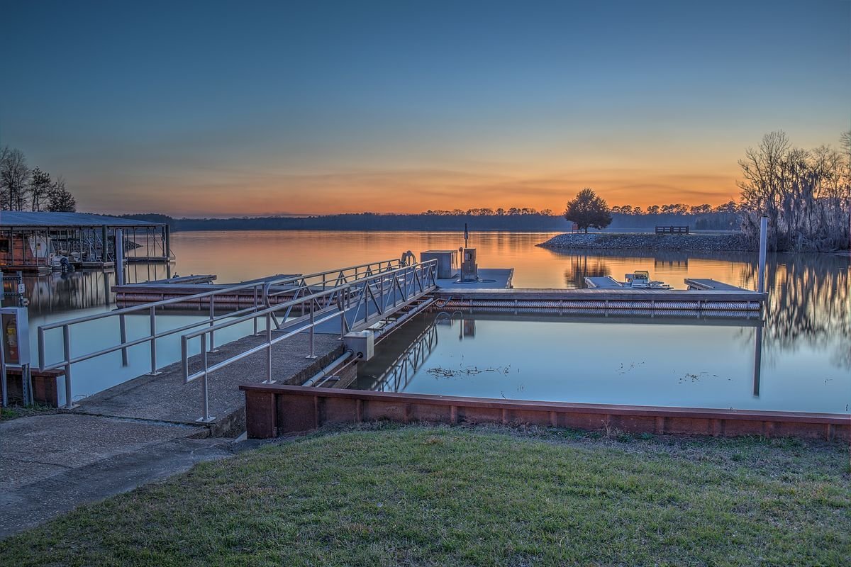 Marina docks glowing at sunset on Lake Walter F. George at Florence Marina State Park