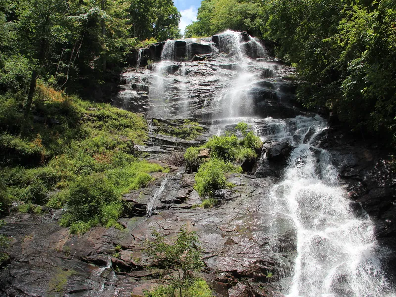 Amicalola Falls cascading over rock ledges in summer