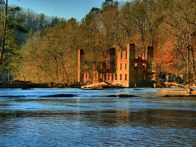 Brick ruins of the New Manchester mill beside Sweetwater Creek in fall