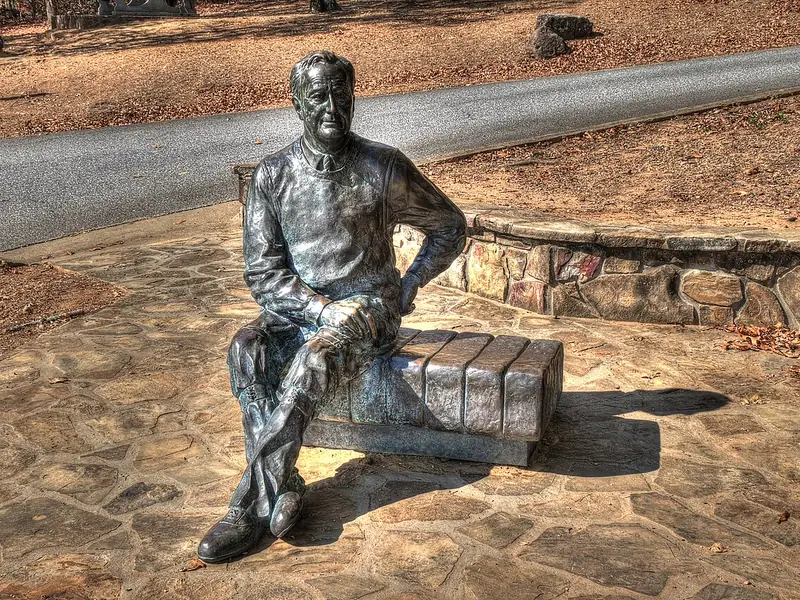 Bronze statue of Franklin D. Roosevelt seated on a bench at F. D. Roosevelt State Park