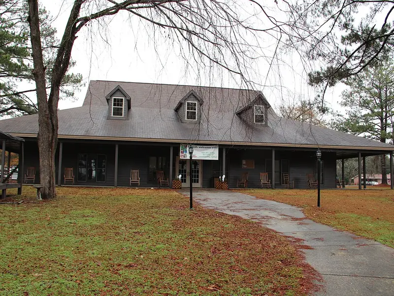Kirbo Interpretive Center with a wide front porch at Florence Marina State Park
