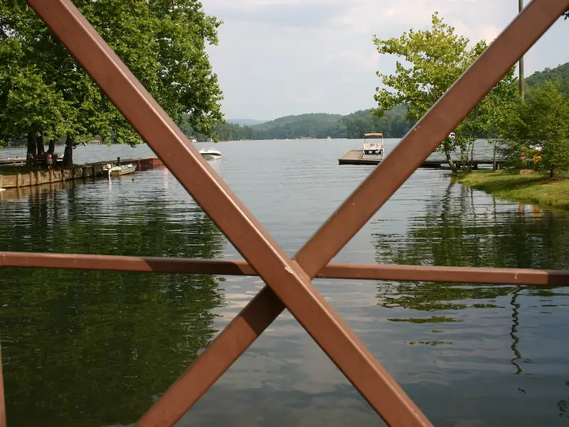 Boat dock seen through a red wooden railing at Moccasin Creek State Park