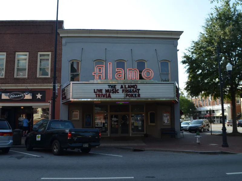 The Alamo theater marquee and brick storefronts on West Court Square in Newnan