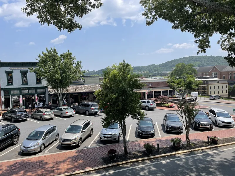 Shops on the public square in downtown Dahlonega with mountains behind