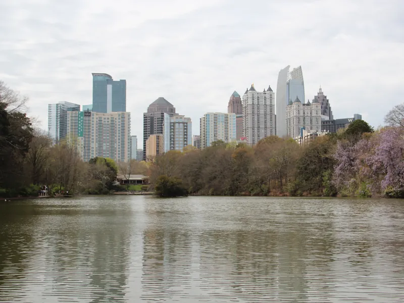 Midtown skyline reflected in Lake Clara Meer at Piedmont Park
