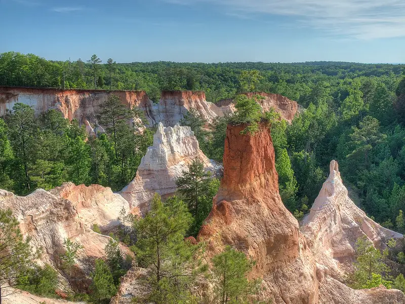 Eroded pink and orange canyon walls seen from the rim at Providence Canyon State Park