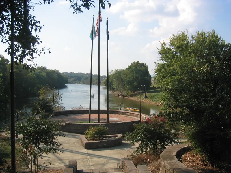 People in a small boat on the Coosa River in Rome, Georgia