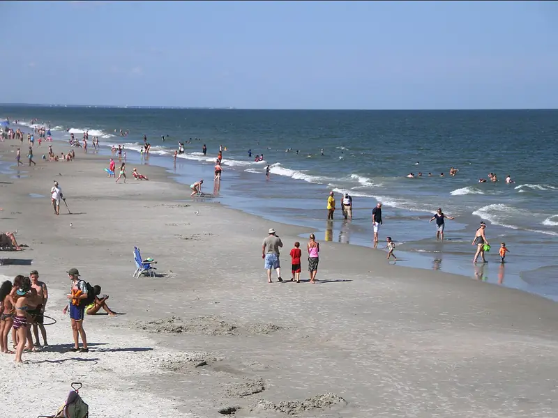 Families on the wide sandy beach at Tybee Island