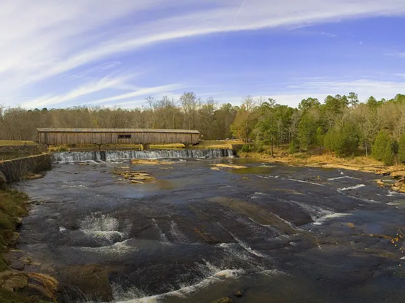 Wide rocky shoals on the South Fork River at Watson Mill Bridge State Park