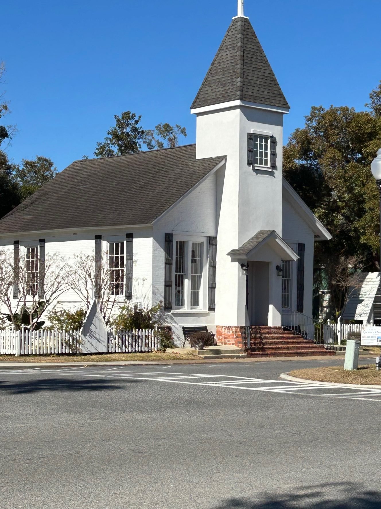 The white historic Our Lady Star of the Sea chapel with its square steeple on Dillingham Street
