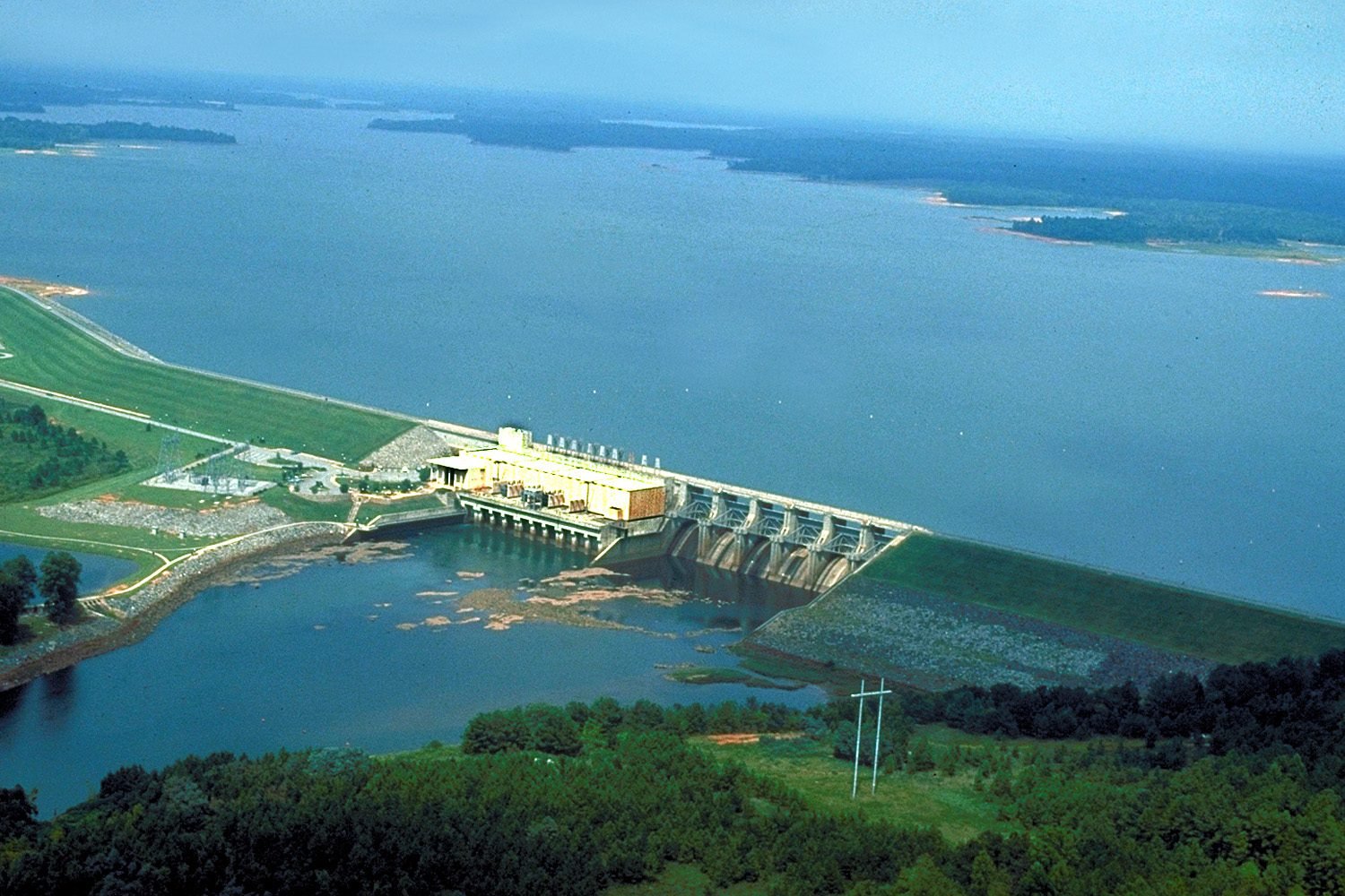 Aerial view of West Point Dam and powerhouse with West Point Lake stretching beyond