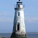 The Cockspur Island Lighthouse rising from an oyster shell islet