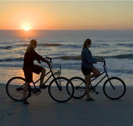 Riding bikes on the beach at Sapelo Island Georgia at sunset