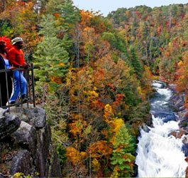 Waterfall in Tallulah Gorge with the suspension bridge visible